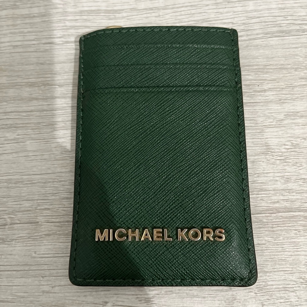 Michael Kors card holder in green. Used- good condition.